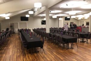 Indoor banquet hall table seating and table settings with black cloth at the Goldstar Venue at the VFW Post 1215 in Rochester, MN.